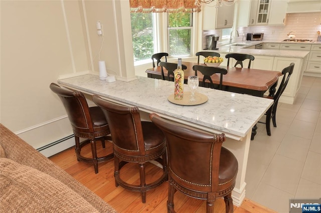 dining area with baseboard heating