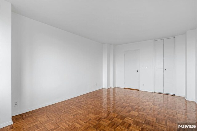 unfurnished bedroom with baseboards
