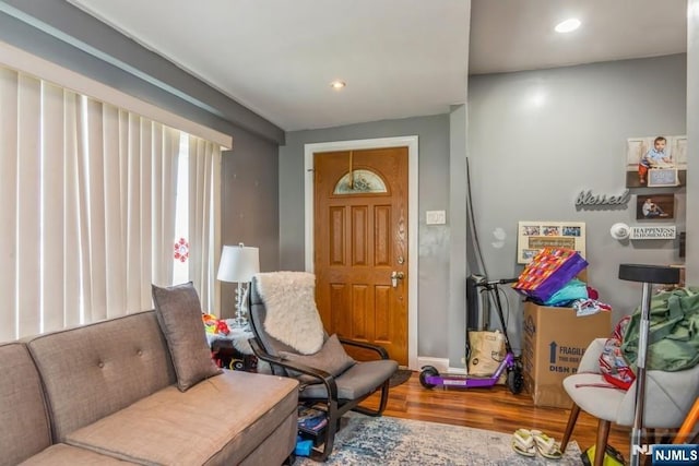 sitting room with recessed lighting, baseboards, and wood finished floors