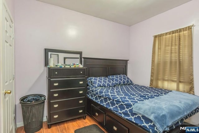 bedroom featuring light wood-style floors