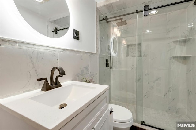 400 Prospect Ave, Oradell, NJ 07649 - bathroom with a marble finish shower, toilet, vanity, and tile walls