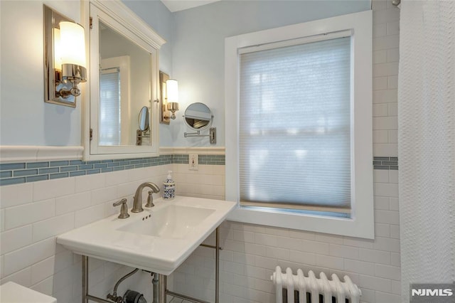 400 Prospect Ave, Oradell, NJ 07649 - full bath with radiator heating unit, tile walls, a shower with curtain, and a sink