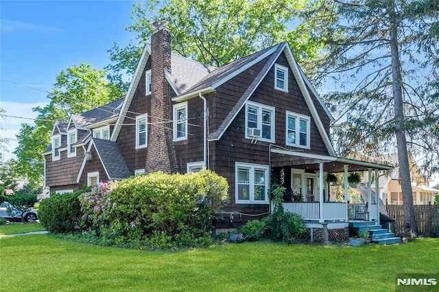 400 Prospect Ave, Oradell, NJ 07649 - view of front of house with covered porch, a chimney, and roof with shingles