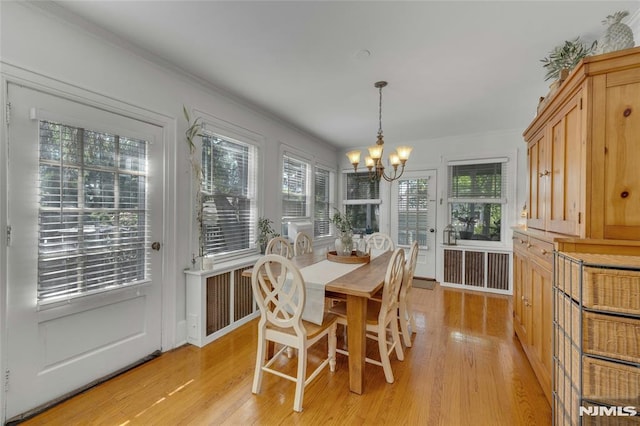 400 Prospect Ave, Oradell, NJ 07649 - dining room with a chandelier, light wood-style flooring, and ornamental molding