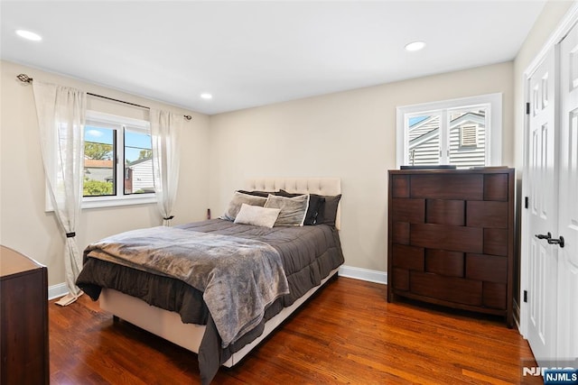 bedroom with recessed lighting, baseboards, a closet, and wood finished floors