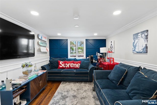 living room featuring dark wood-type flooring, a decorative wall, ornamental molding, and recessed lighting