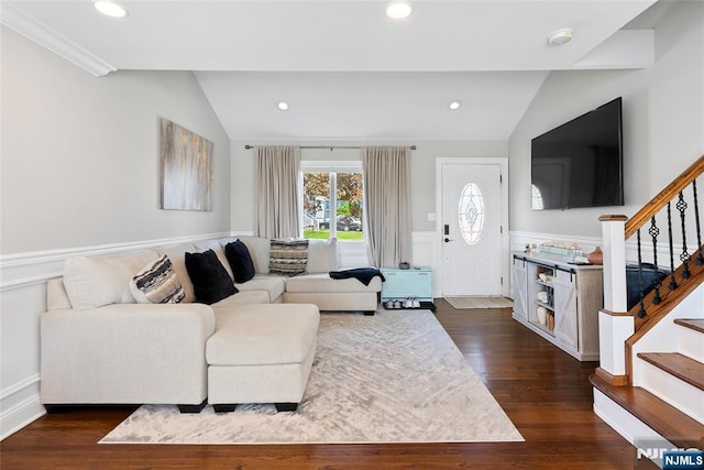 living area featuring vaulted ceiling, recessed lighting, wainscoting, stairs, and dark wood-type flooring