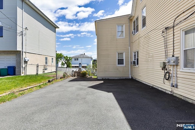 view of side of home with fence