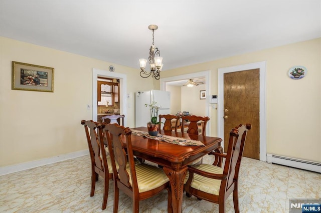 dining room featuring a chandelier and a baseboard radiator