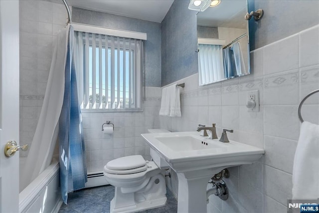 full bathroom featuring tile walls, toilet, shower / bath combination with curtain, and tile patterned flooring