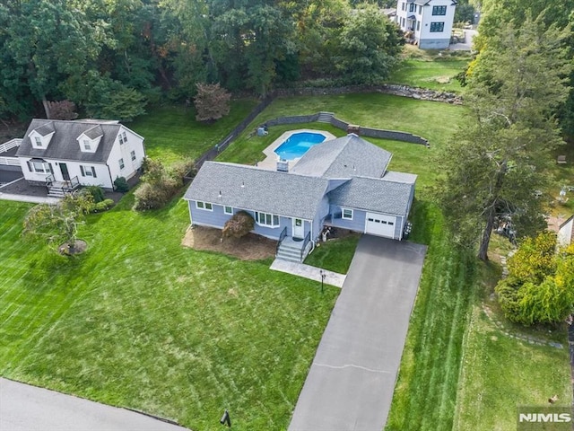 view of subject property featuring a pool