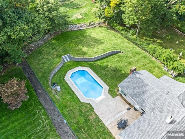 drone / aerial view of a pool area