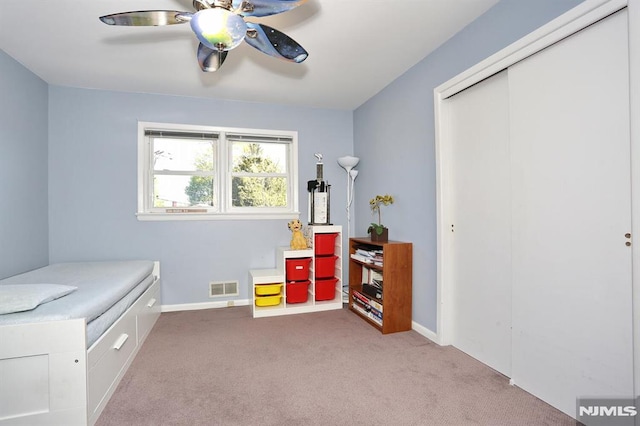 rec room with ceiling fan, carpet flooring, baseboards, and visible vents