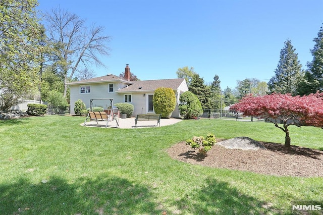 view of yard featuring a patio area and fence