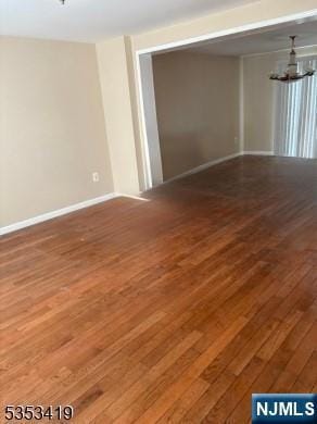 55 2nd St, South Orange Village, NJ 07079 - unfurnished room featuring hardwood / wood-style floors, a chandelier, and baseboards