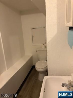 55 2nd St, South Orange Village, NJ 07079 - bathroom with toilet and wood finished floors