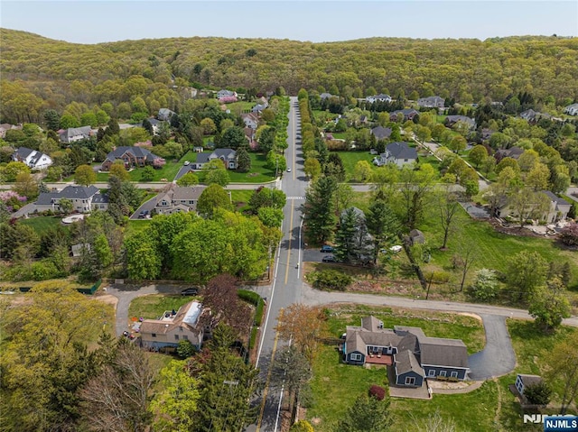 aerial view with a forest view and a residential view