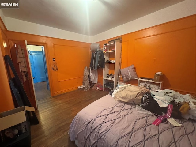 bedroom featuring a closet and wood finished floors