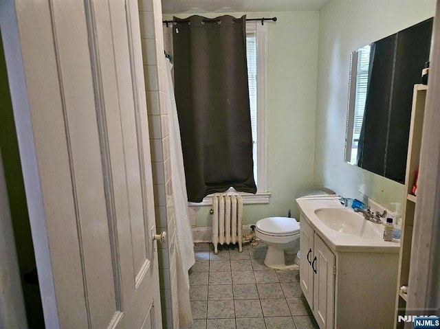 full bathroom featuring radiator heating unit, toilet, vanity, and a shower with shower curtain