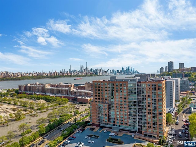 exterior space featuring a water view and a view of city