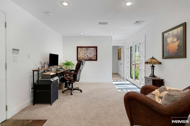 office space with baseboards, recessed lighting, visible vents, and light colored carpet