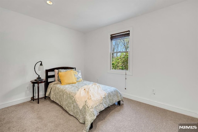 bedroom with light colored carpet, baseboards, and recessed lighting