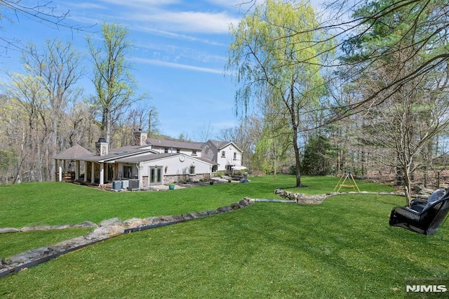 view of yard featuring central AC