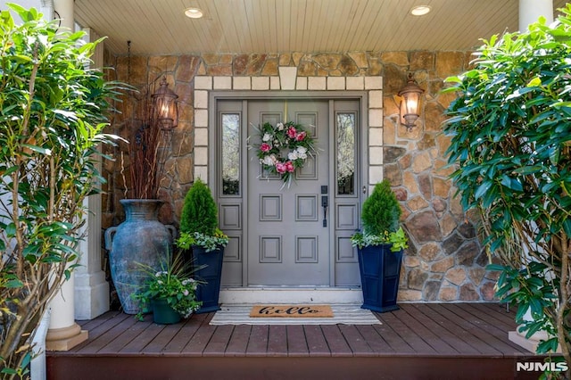 entrance to property with stone siding