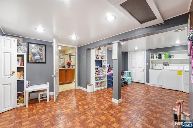 basement with separate washer and dryer, baseboards, and recessed lighting