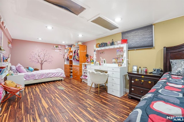 bedroom featuring recessed lighting and wood finished floors
