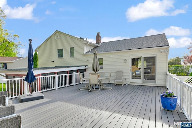 deck with outdoor dining area