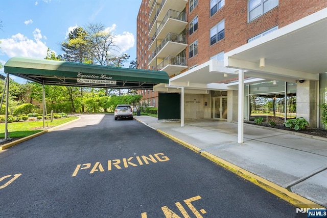 view of partially covered parking lot