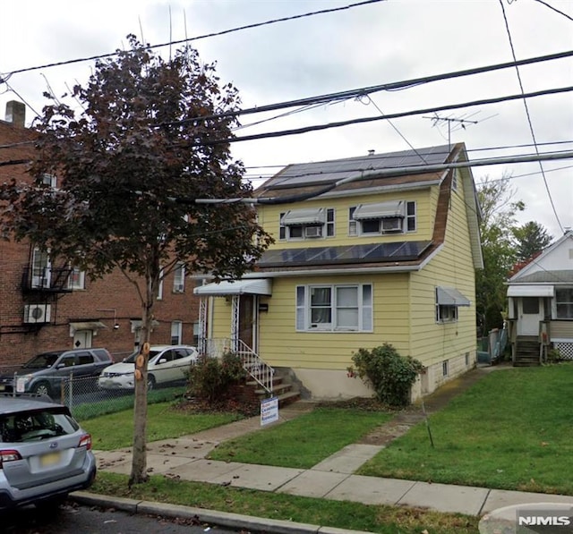 257 Palisade Ave, Garfield, NJ 07026 - view of front of house featuring a front lawn and entry steps