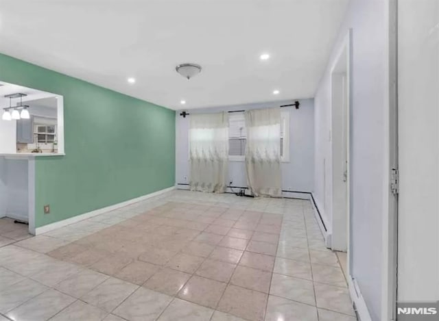 spare room with light tile patterned flooring, baseboards, and recessed lighting