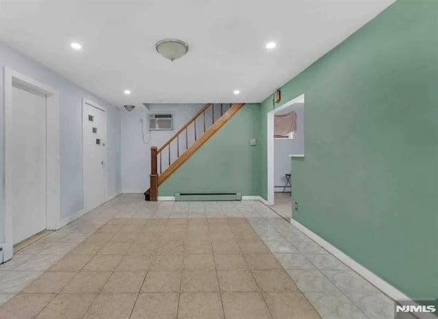 interior space featuring stairway, a wall mounted AC, baseboard heating, and recessed lighting
