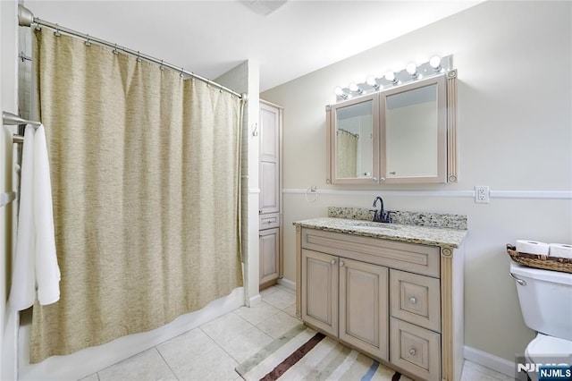 full bath with toilet, tile patterned flooring, and vanity