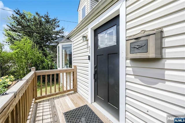 doorway to property featuring a deck