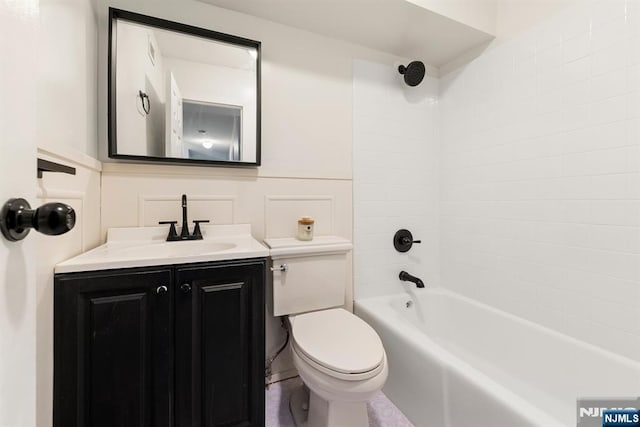 bathroom featuring shower / bathing tub combination, vanity, and toilet