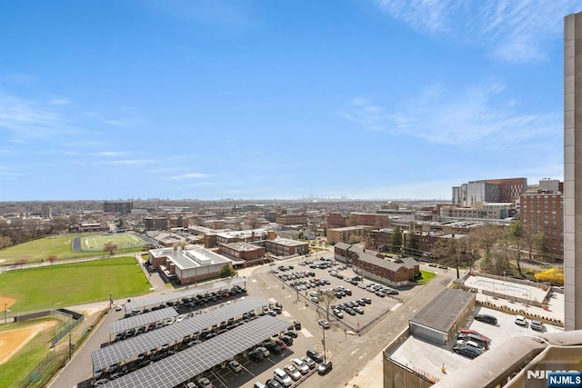 birds eye view of property with a city view