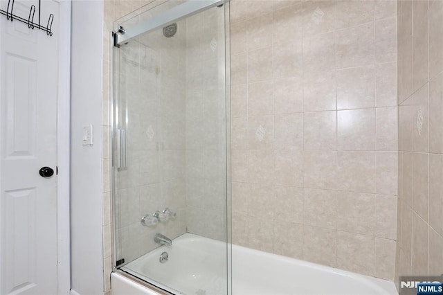 full bathroom featuring combined bath / shower with glass door