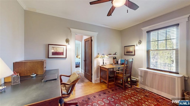 office with radiator heating unit, ceiling fan, wood finished floors, crown molding, and baseboards