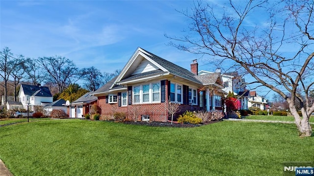 view of property exterior with brick siding, a chimney, and a lawn