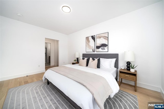 649 38th St Unit 409, Union City, NJ 07087 - bedroom with baseboards and light wood-style flooring