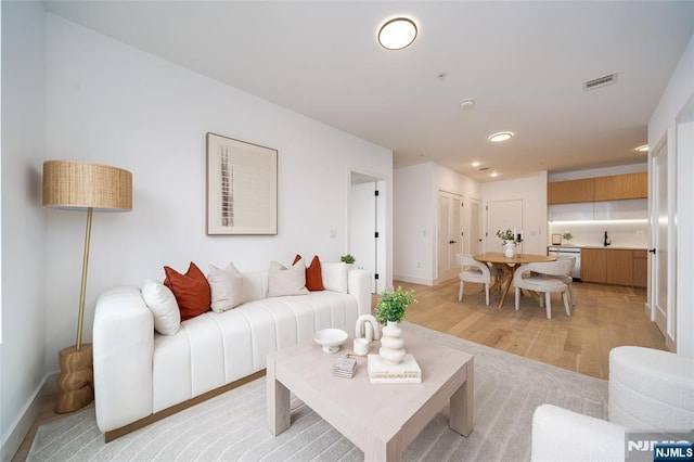 649 38th St Unit 409, Union City, NJ 07087 - living area featuring visible vents, recessed lighting, light wood finished floors, and baseboards