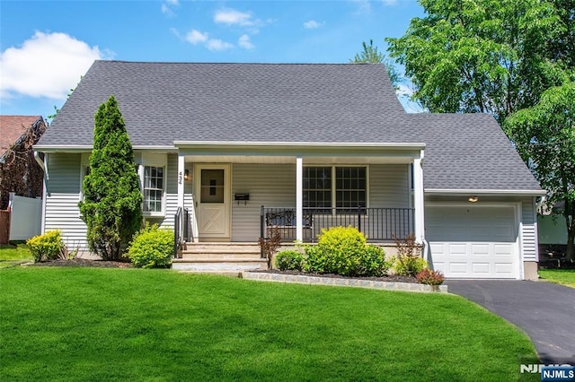 434 Argyle St, Oradell, NJ 07649 - view of front facade with a garage, a front lawn, driveway, a porch, and roof with shingles