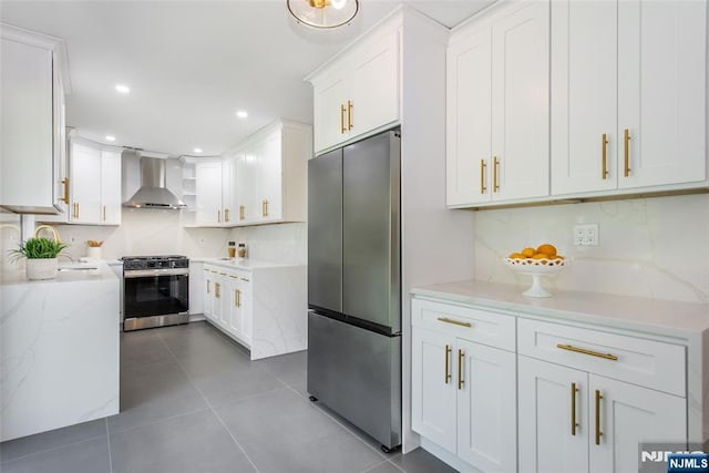 434 Argyle St, Oradell, NJ 07649 - kitchen with wall chimney range hood, stainless steel appliances, tasteful backsplash, white cabinets, and recessed lighting