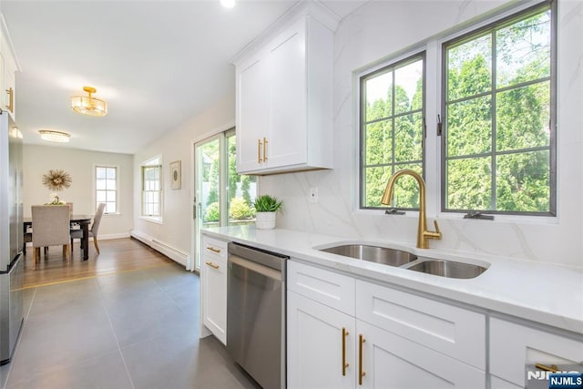 434 Argyle St, Oradell, NJ 07649 - kitchen featuring stainless steel appliances, a baseboard radiator, a sink, tile patterned floors, and white cabinets