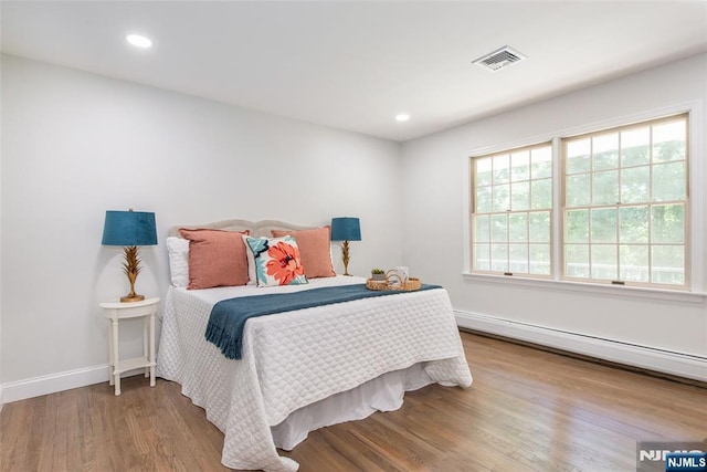 434 Argyle St, Oradell, NJ 07649 - bedroom with wood finished floors, baseboard heating, baseboards, and recessed lighting