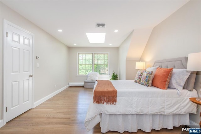 434 Argyle St, Oradell, NJ 07649 - bedroom with a skylight, light wood-style flooring, baseboards, baseboard heating, and recessed lighting