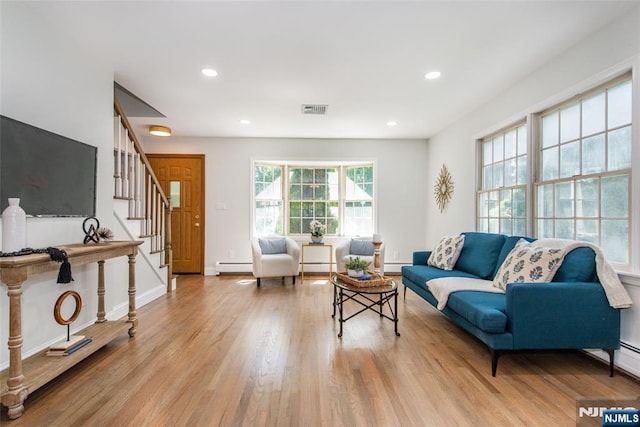 434 Argyle St, Oradell, NJ 07649 - living room featuring a baseboard radiator, wood finished floors, stairs, recessed lighting, and baseboards